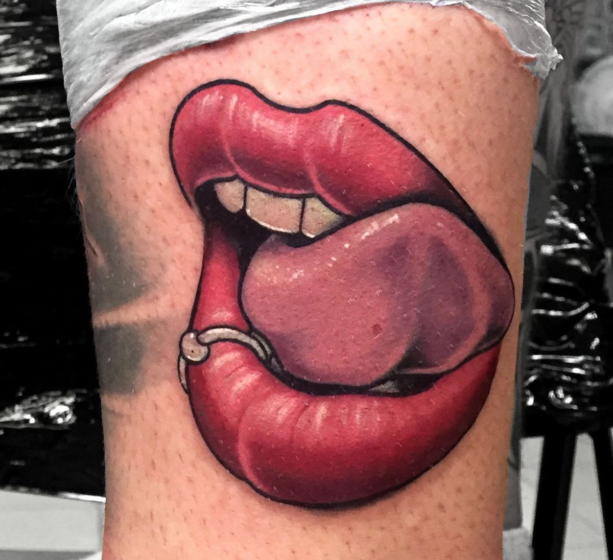 Girl kissing dick tattoo